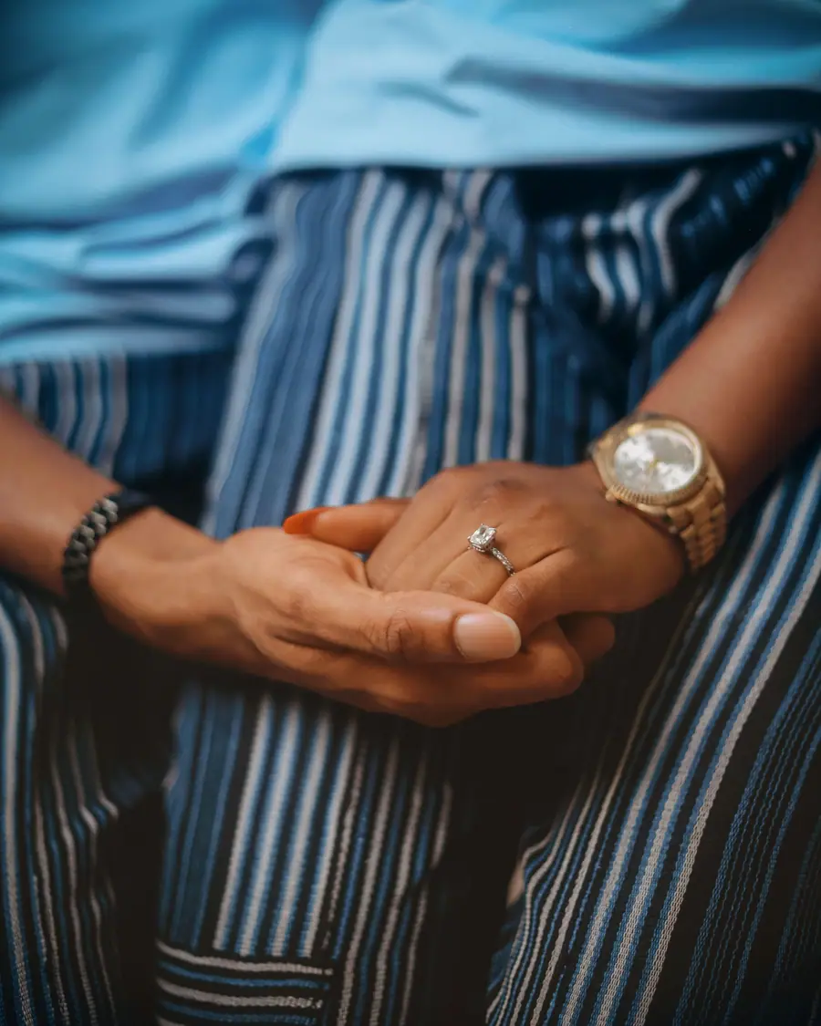 Close-up of Amara's engagement ring, hands held together